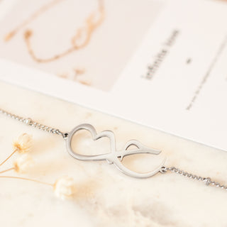 Close up of Arabic silver bracelet with infinity love symbol