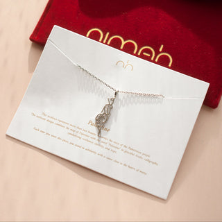 Palestine Necklace on a card with a red pouch in the background
