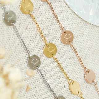 A trio of islamic bracelets in gold, silver and rose gold with engravings in Arabic