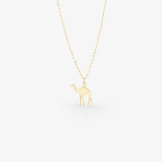 image of gold camel necklace on white background
