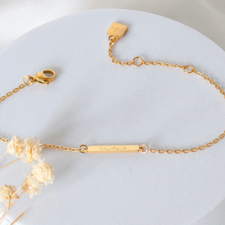 'With hardship comes ease' engraved gold Arabic bracelet