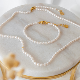 image of Tasbih pearl necklace and bracelet laid out on table